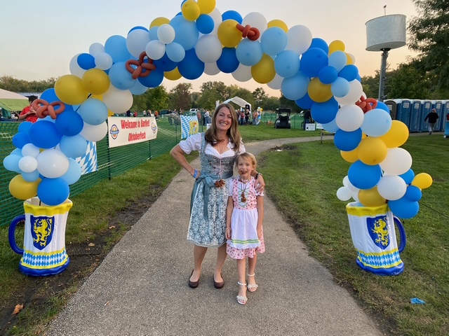 Stephanie Gandsey volunteers with her daughter at Bartlett's Oktoberfest